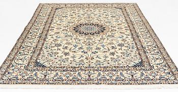 A carpet, Nain, part silk, fine 9 laa, signed, ca 327 x 210 cm.