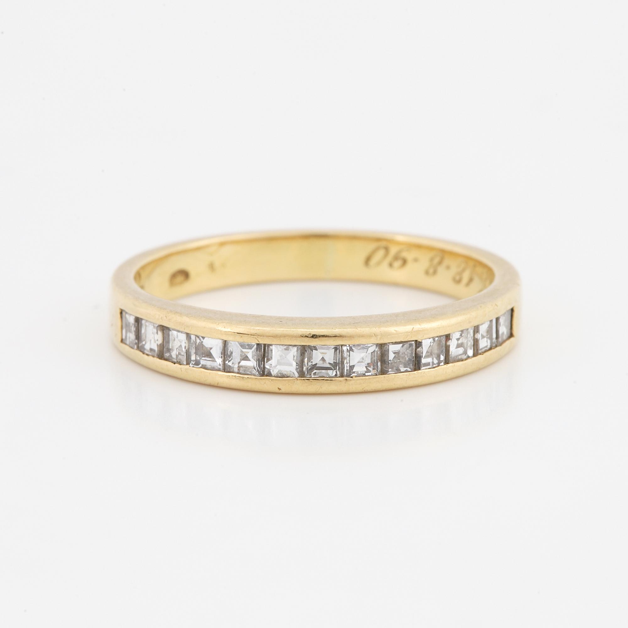 Step-cut diamond ring.