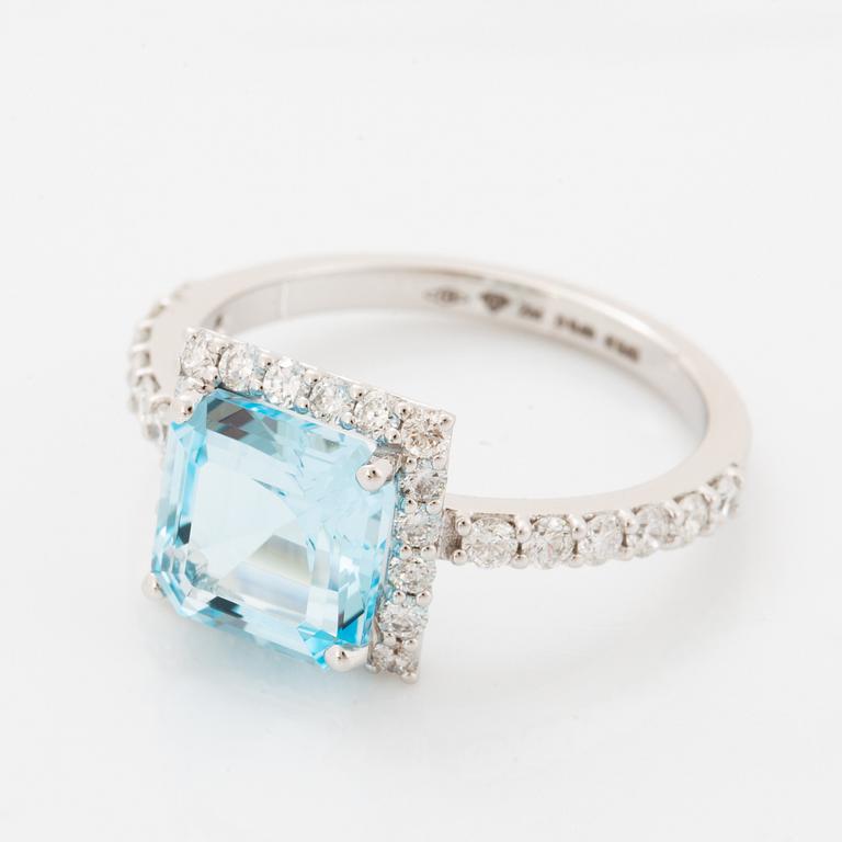 Blue topaz and brilliant-cut diamond ring.