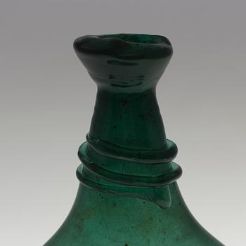 A 18th century glass bottle.