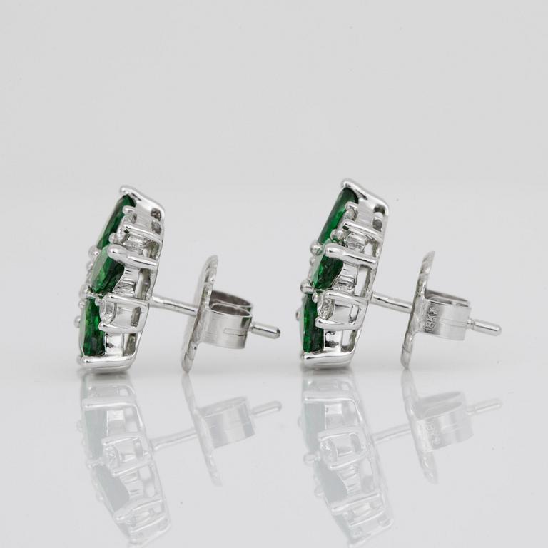 A pair of tsavorite garnet and diamond earrings. Total carat weight of tsavorites circa 4.80 cts and diamonds circa 1 ct.