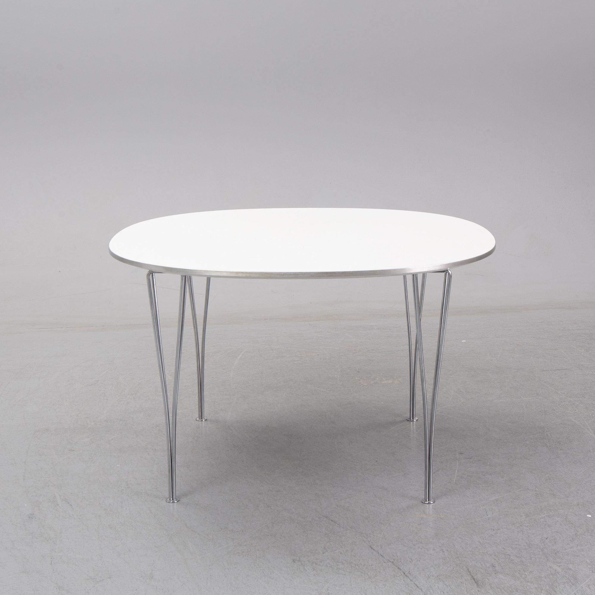 A 'Supercircle table by Bbruno Marthsson & Piet Hein for Fritz Hansen, dated 2000.