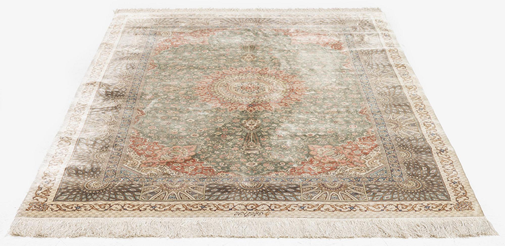 A silk Qum, Central Persia. signed Mohammad Gamshidi, c. 203 x 126 cm.