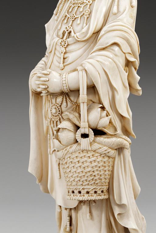 A Japanese ivory figure of Guanyin, probably Meiji period (1868-1912). Signed.