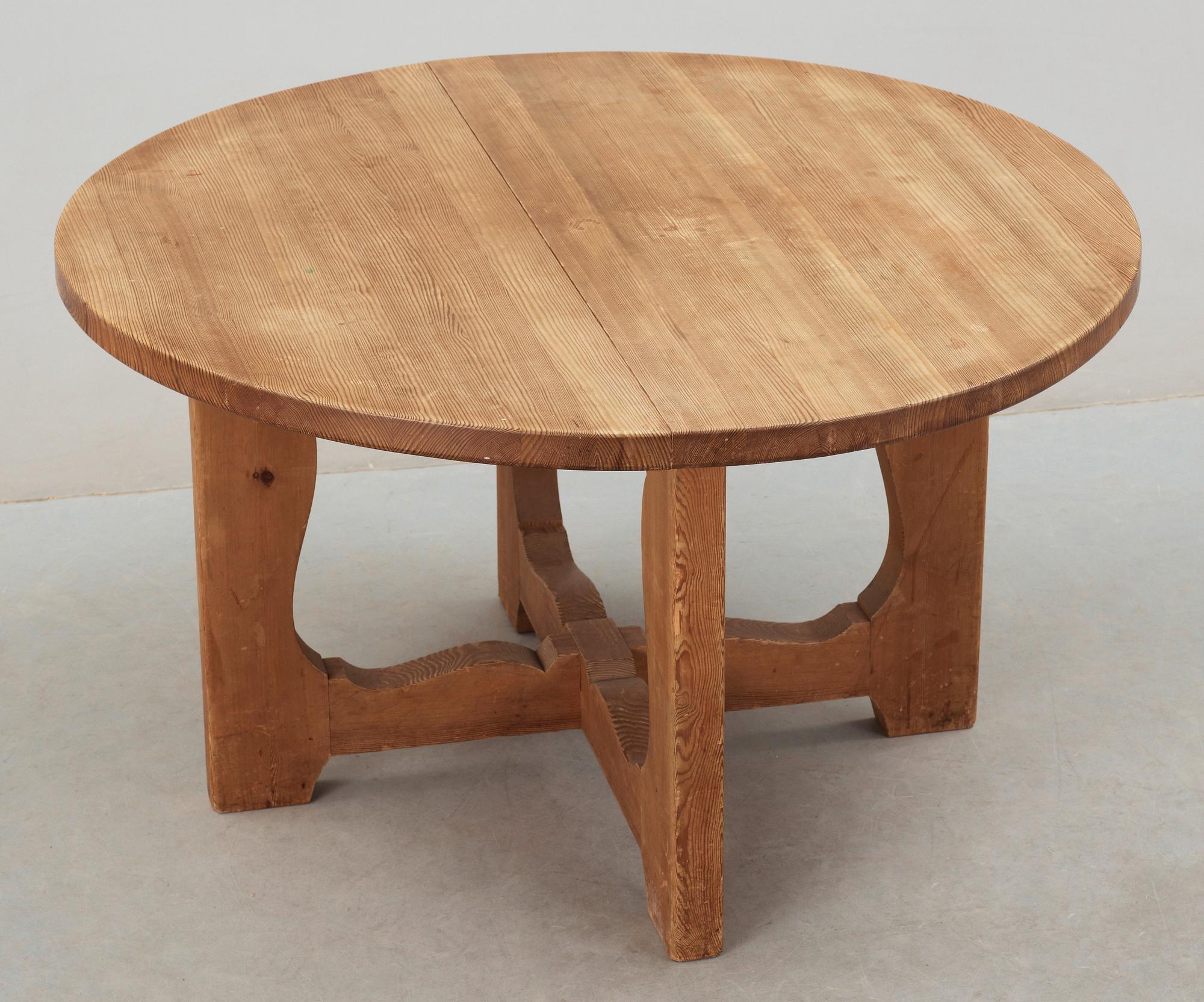A stained pine dining table, attributed to Axel Einar Hjorth, Nordiska Kompaniet, 1930's.