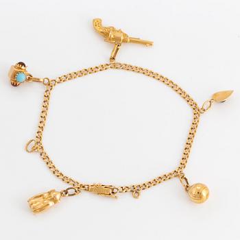 18K gold bracelet with charms.