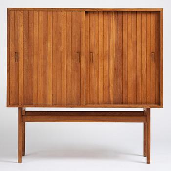 Jørgen Høj, an oak cabinet, Knud Willadsen Møbelsnedkeri, Lillerød, Denmark, 1950s.
