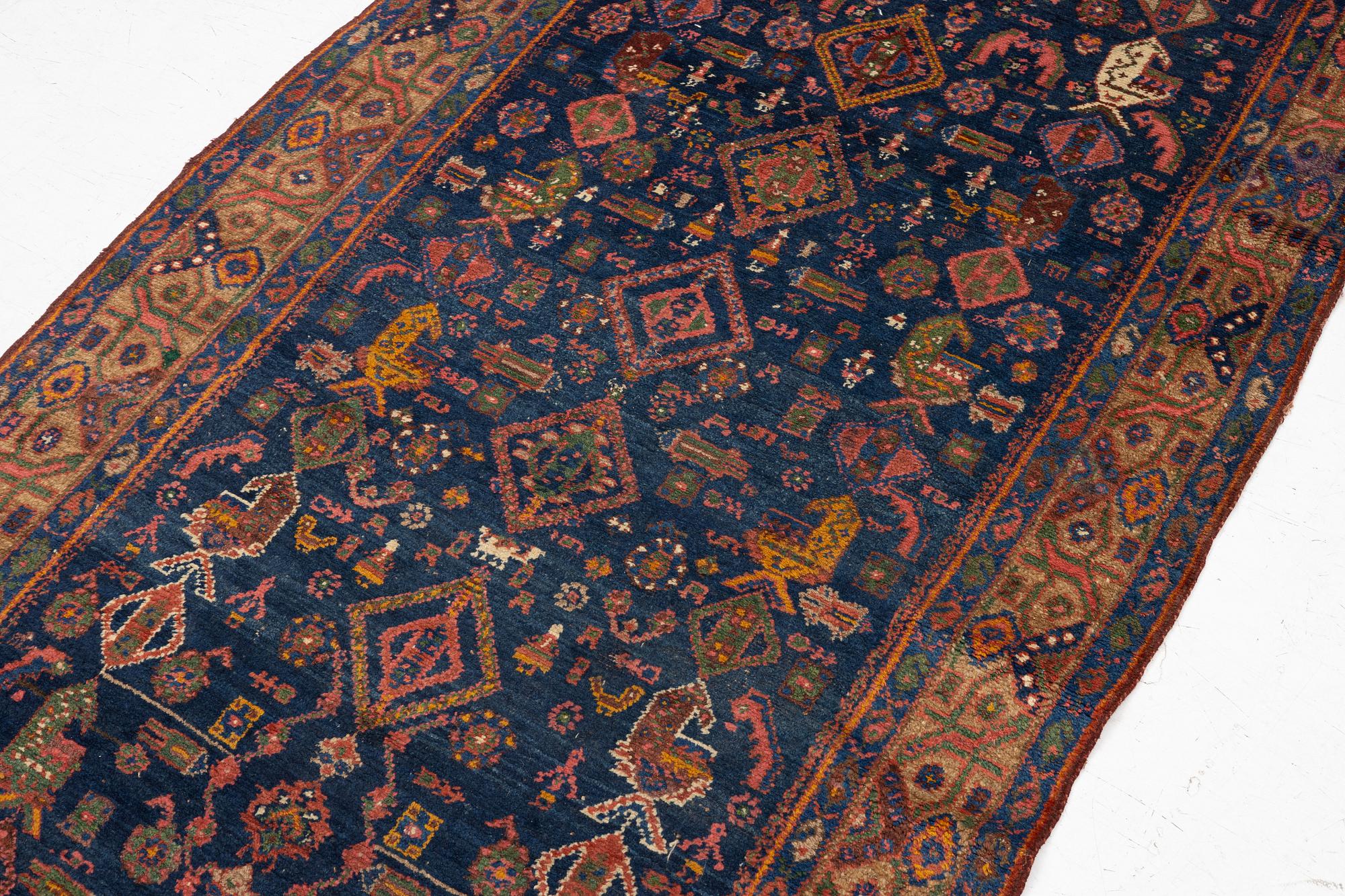 A semi-antique Northwest Persian runner, c. 388 x 94 cm.