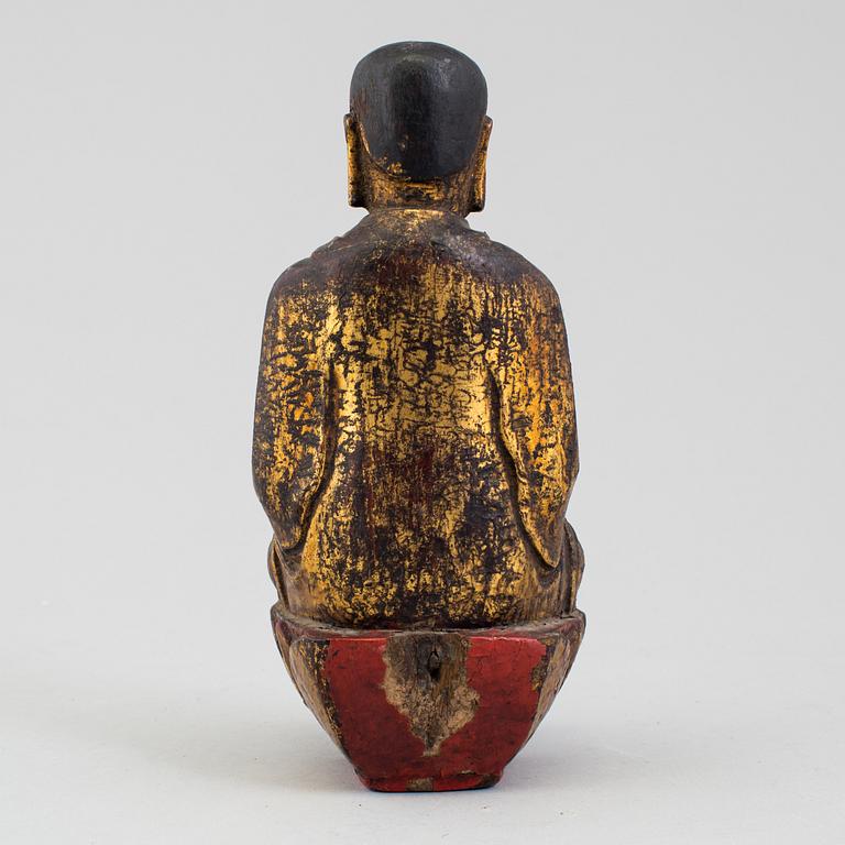 A wooden Japanese sculpture of a deity, 19th Century.