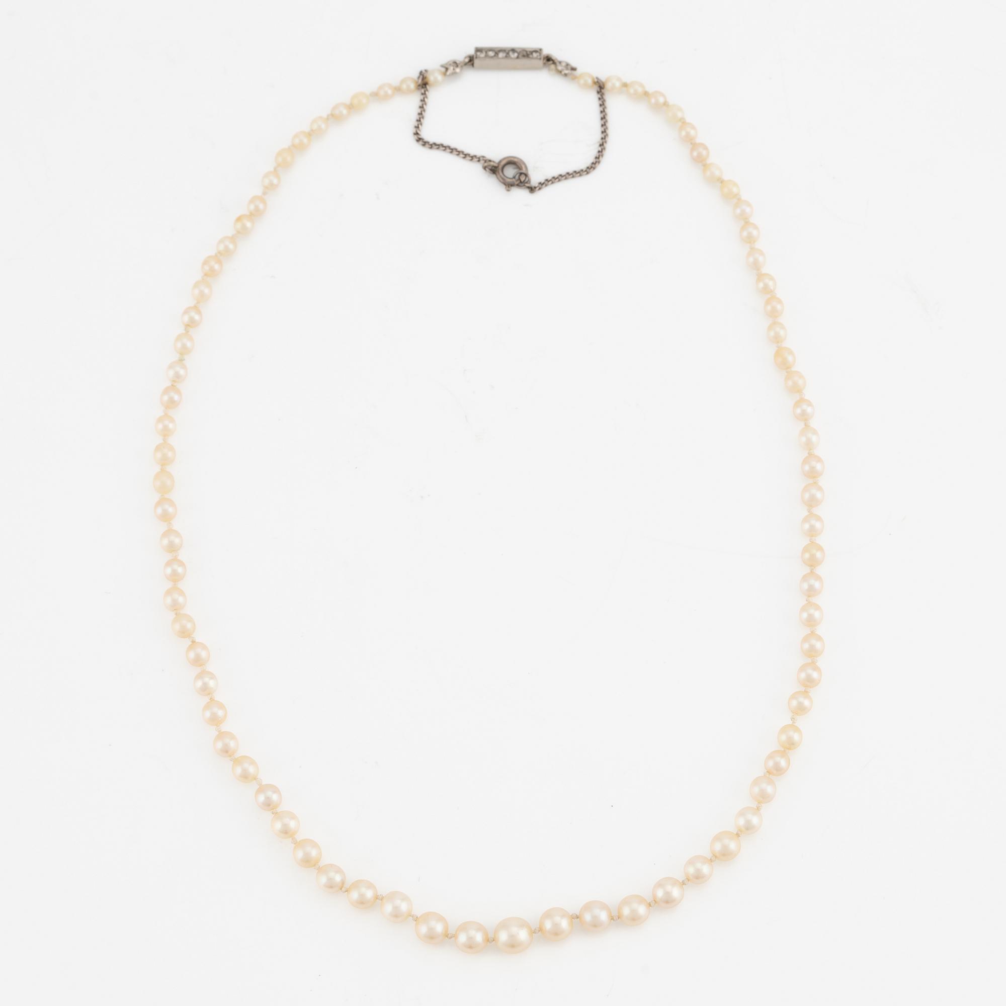 Necklace with cultured graduated pearls, white gold clasp with rose-cut diamonds.