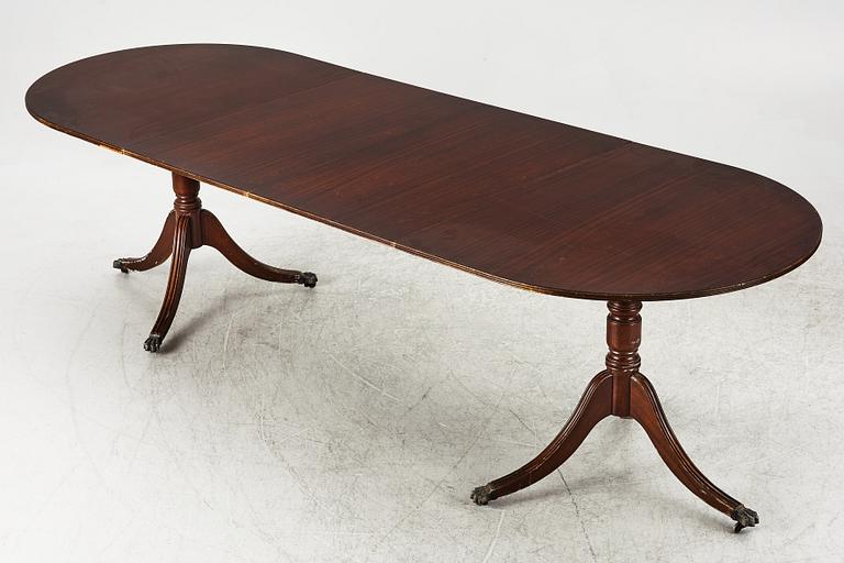 A dining table, 20th century, England.