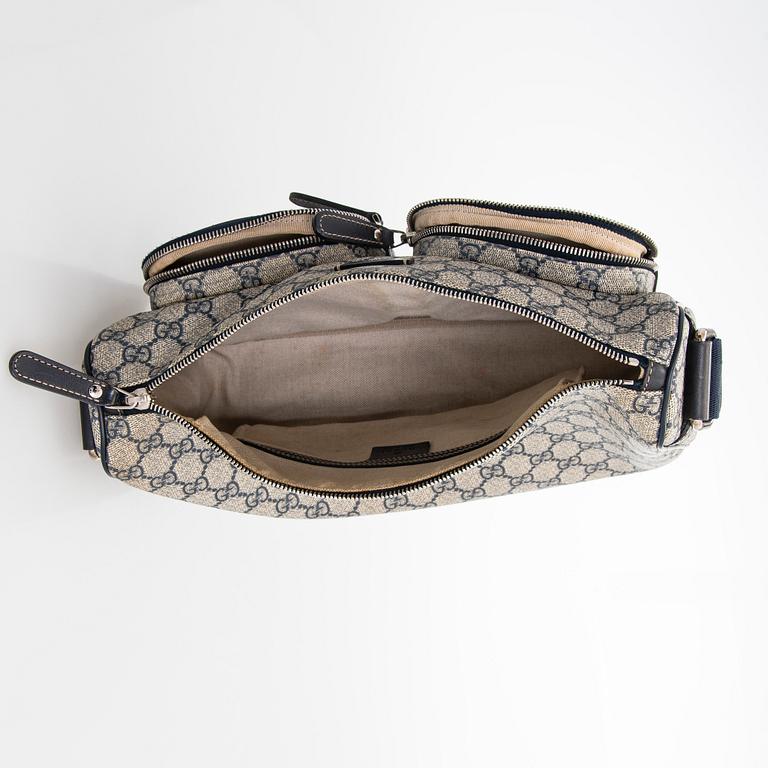 Gucci, A "GG Supreme messenger" bag.
