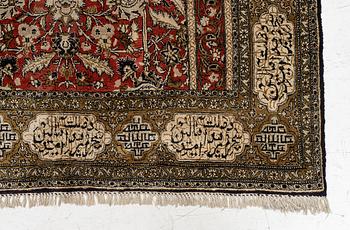 A silk Qum rug, c. 172 x 105 cm.