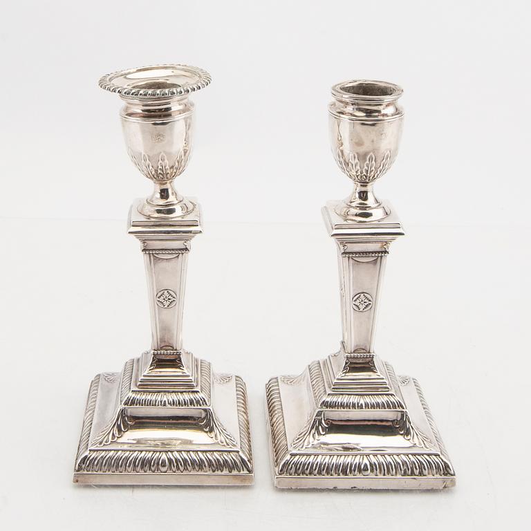 An English 20th century pair of silver candle sticks mark of Mappin & Webb London around 1900.