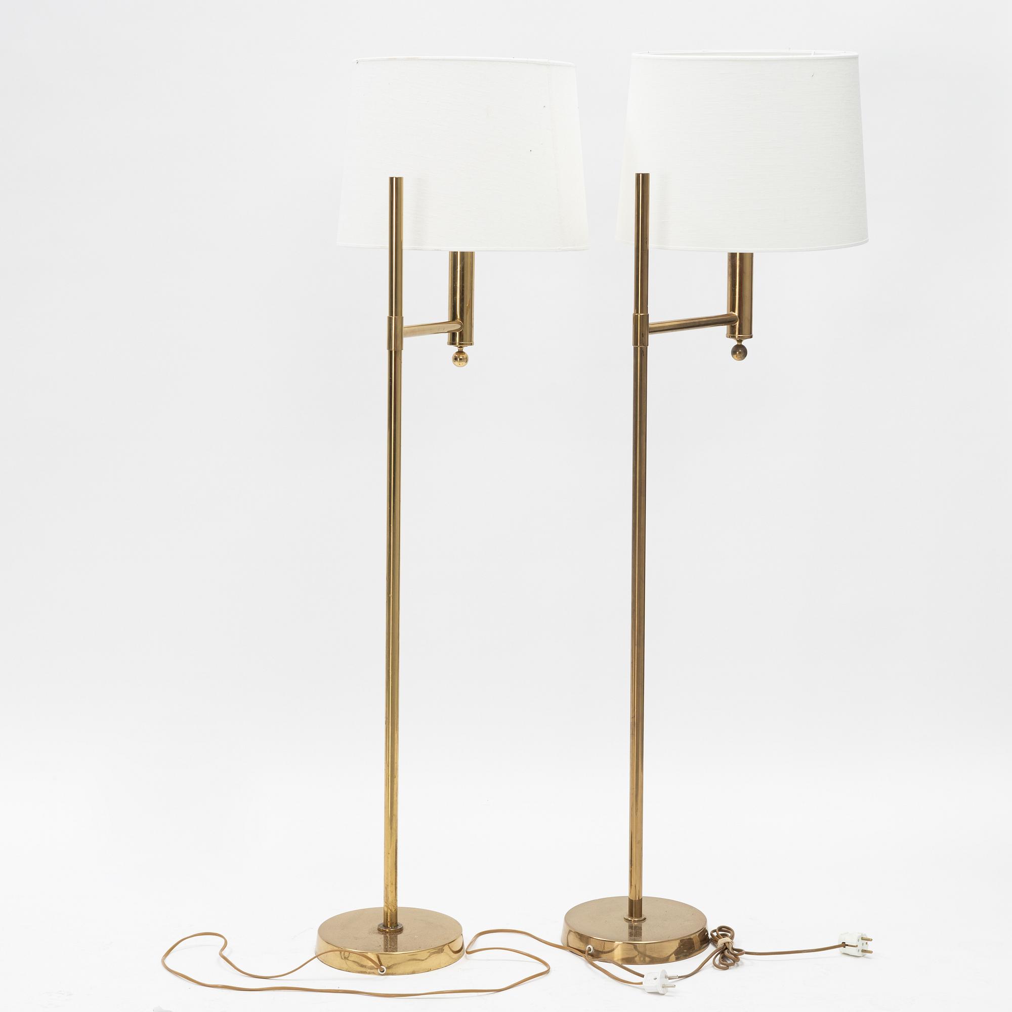 A pair of model 'G-18' brass floor lights, Bergboms, second half of the 20th Century.