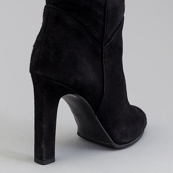 Black suede boots by Yves Saint Lurent.