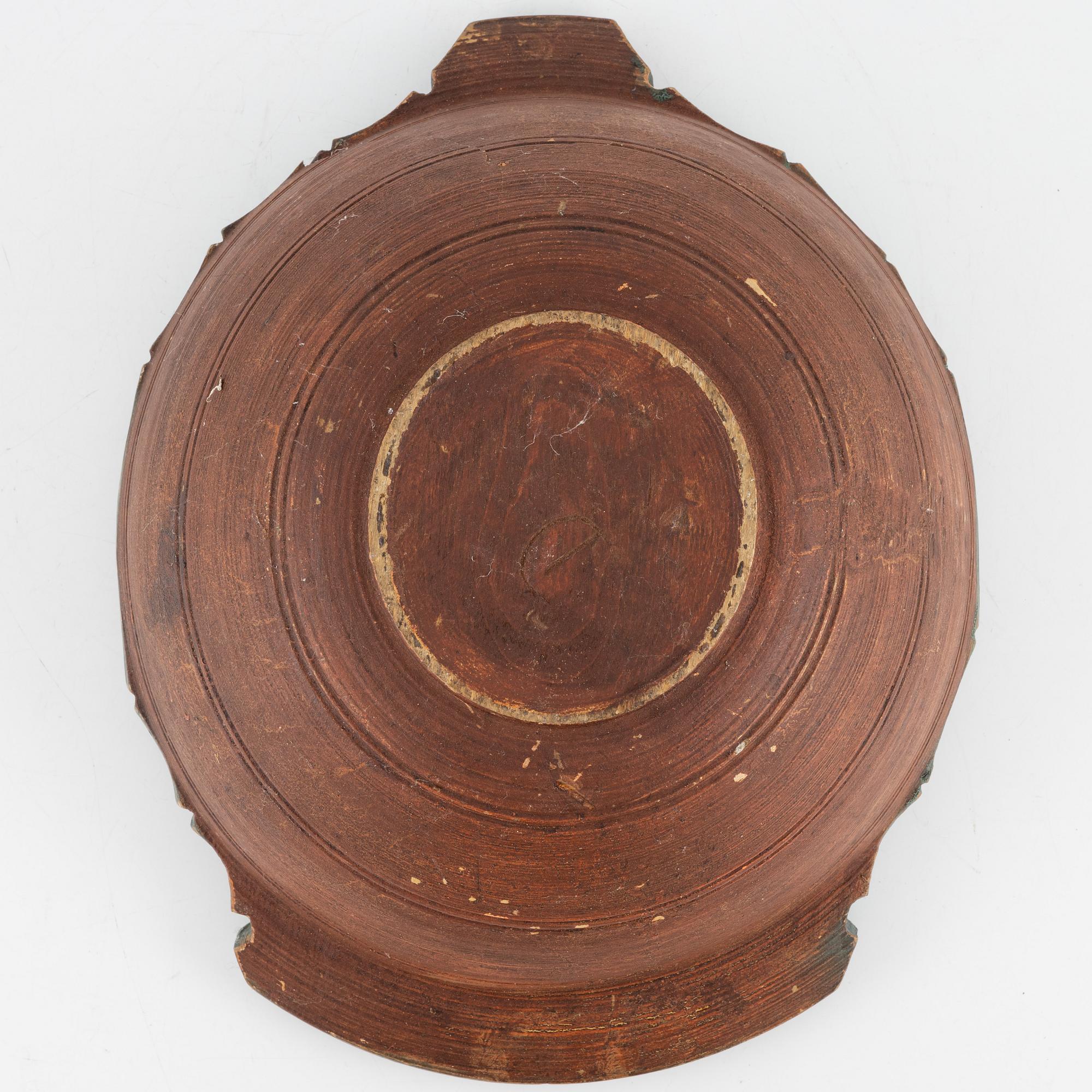 A lathed and painted bowl dated 1783.