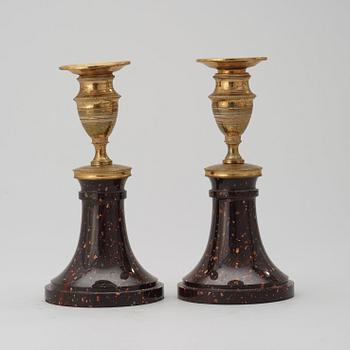 A pair of late Gustavian circa 1800 porphyry and gilt bronze candlesticks.