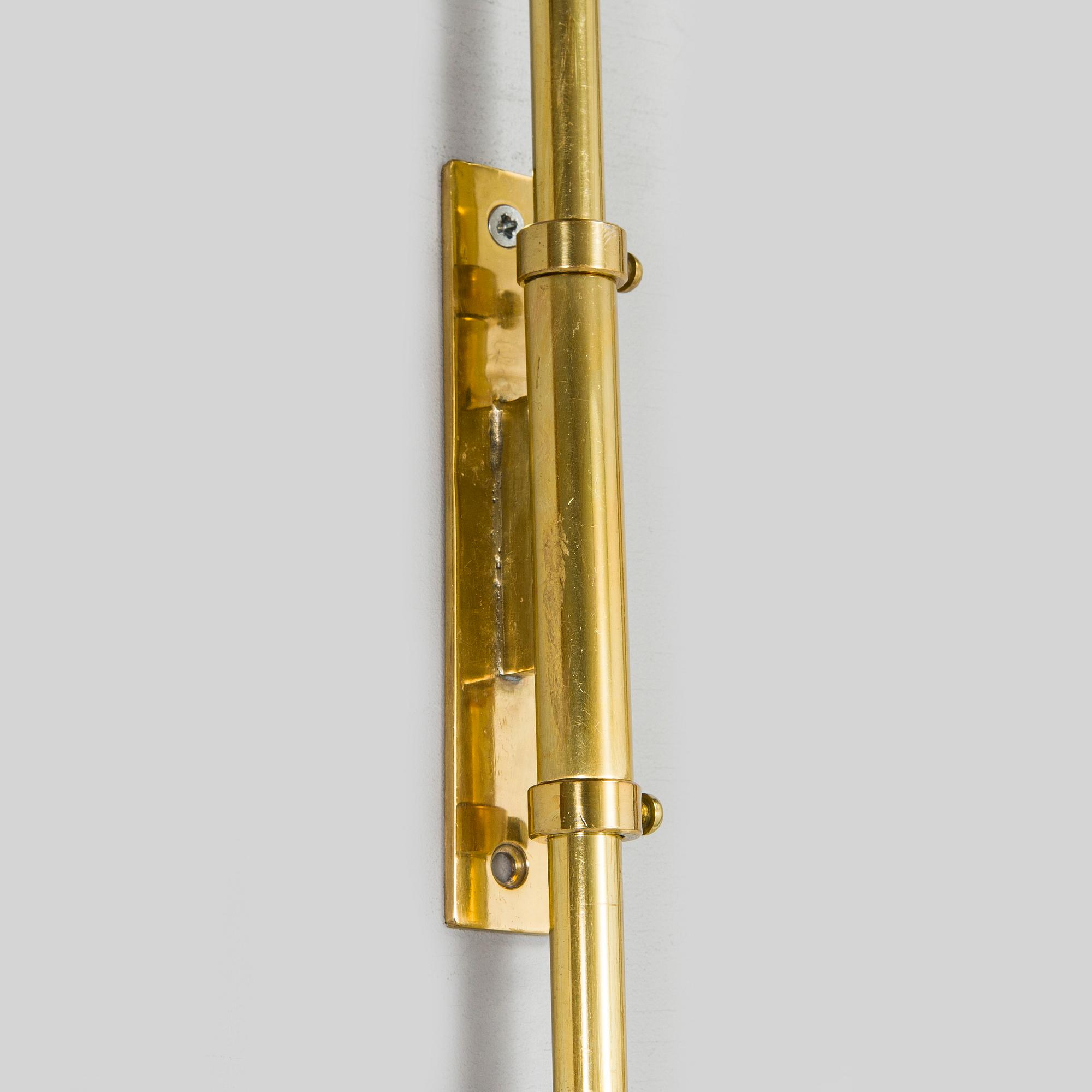 Ilmari Tapiovaara, a 1960s wall light for Metallikolmikko Oy.