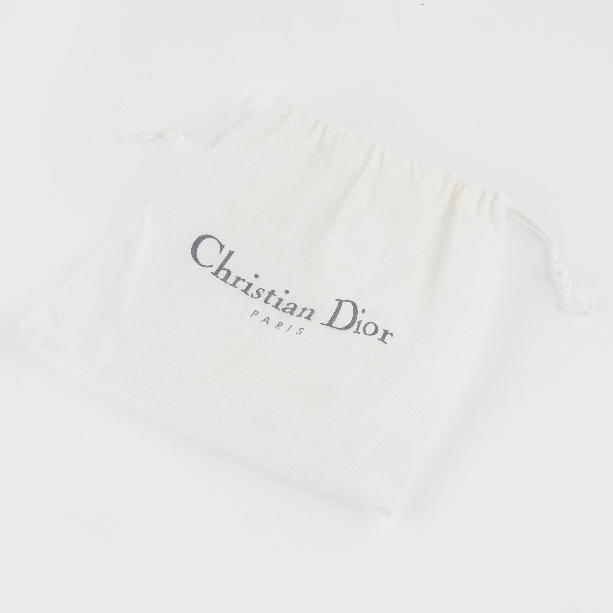 Christian Dior, A vintage 'Mini saddle clutch'.