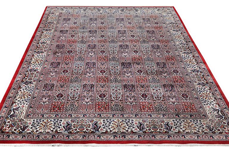 A part silk Ghom carpet, c. 346 x 251 cm.