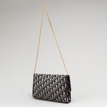 CHRISTIAN DIOR, a set of a clutch, a belt and an umbrella.