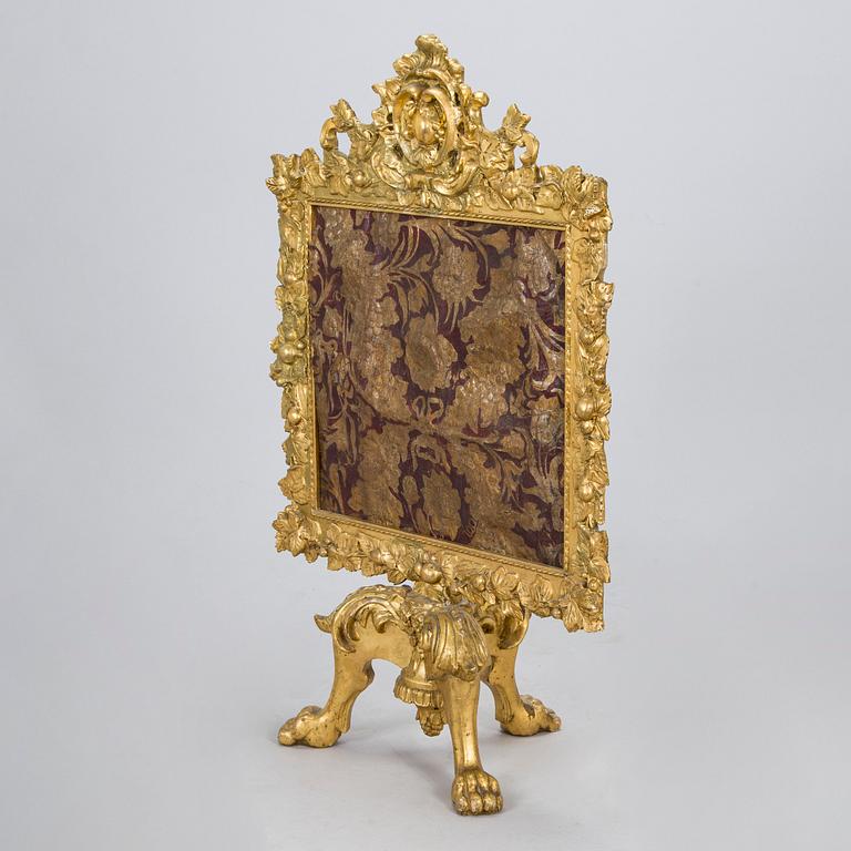 A Baroque style/Rococo revival brass protection, late 19th century.