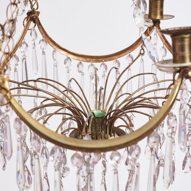 A Gustavian gilt brass and cut glass four-light chandelier, Stockholm, late 18th century.