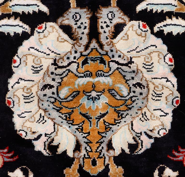 A carpet, Figural Silk Qum, ca 309 x 200 cm.