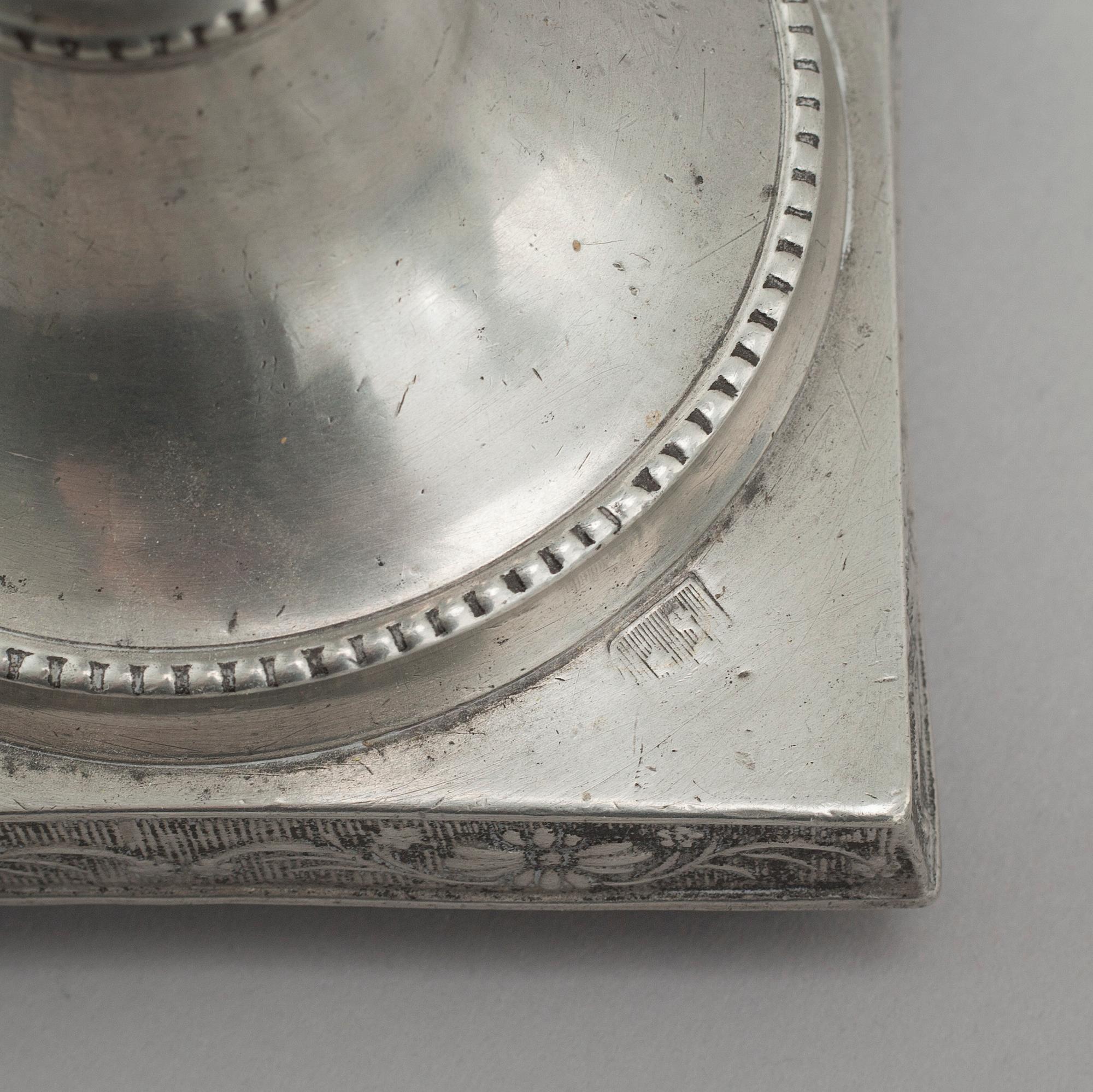 A pair of pewter candlesticks, probably by Gustaf Frederic Wigholm in Eskilstuna, first half of the 19th century.