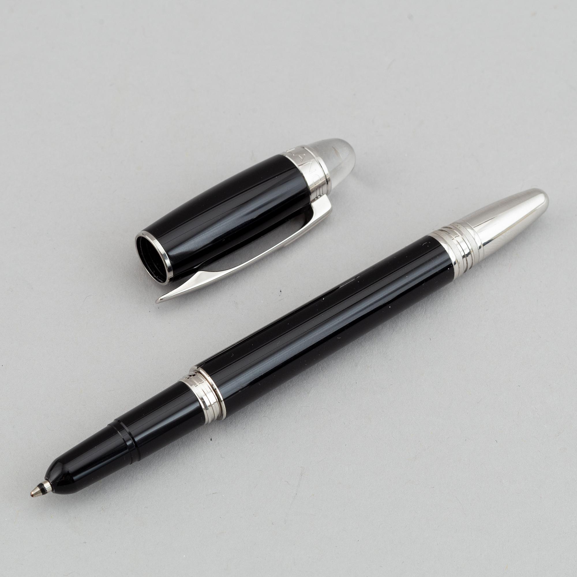 MOntblanc, a ball point pen and leather passport holder.