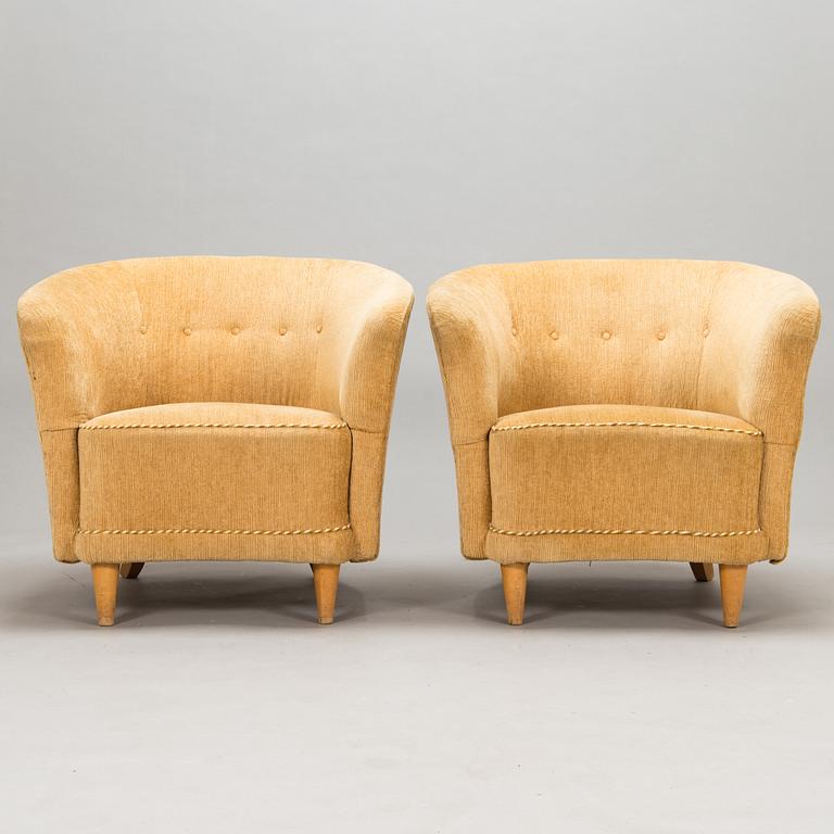 A pair of 1950's armchairs.