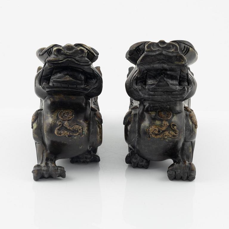 A pair of Chinese stone sculptures of mythical creatures, 20th Century.