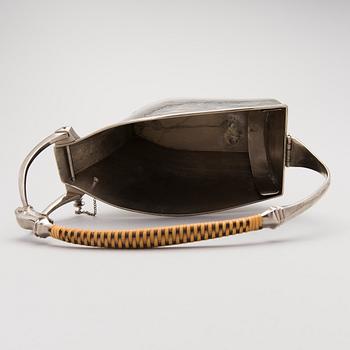 A metal wine bottle stand from WMF, Geislingen, Germany first half of the 20th Century.