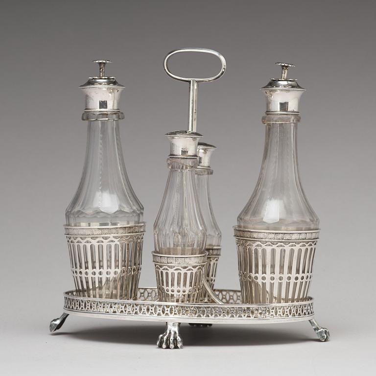 A Swedish early 19th century silver and glass cruet-set, marked Pehr Zethelius, Stockholm 1808.