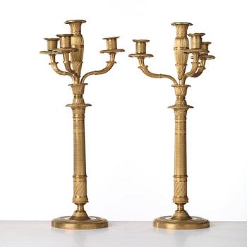 A pair of French Empire early 19th century four-light candelabra.