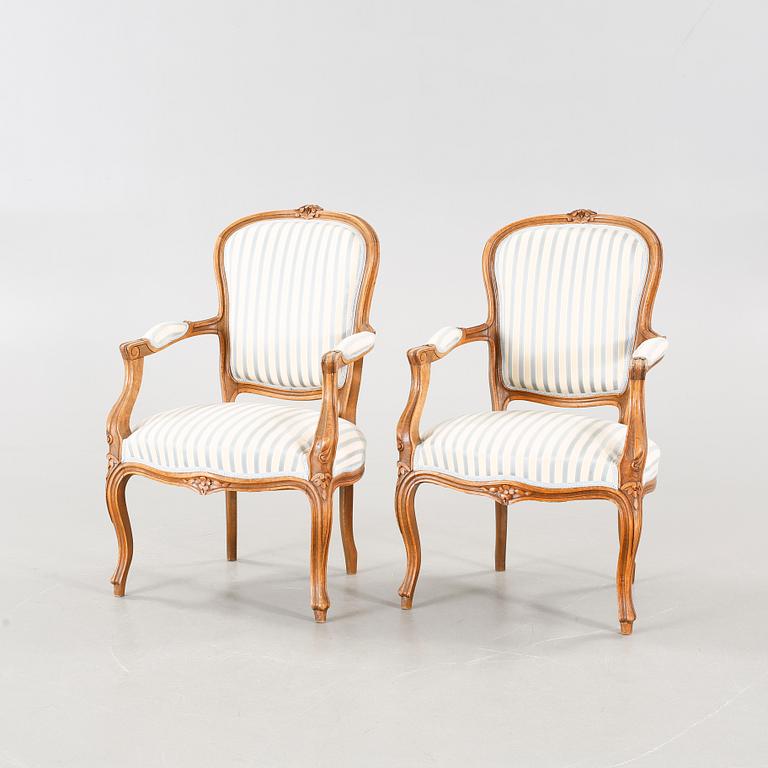 A pair of mid 20th century armchairs.