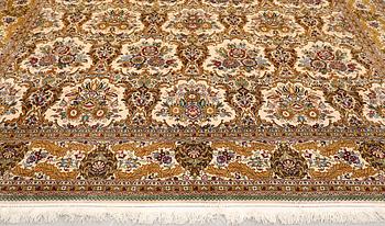 A part silk Ghom carpet, c. 420 x 310 cm.