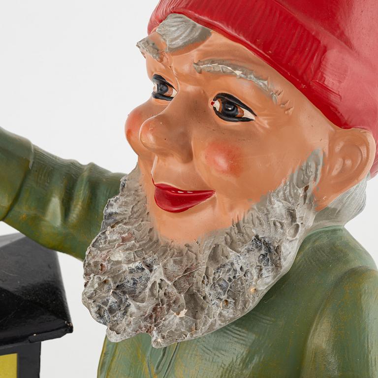 A West German earthenware gnome figurine with lantern from the second half of the 20th century.