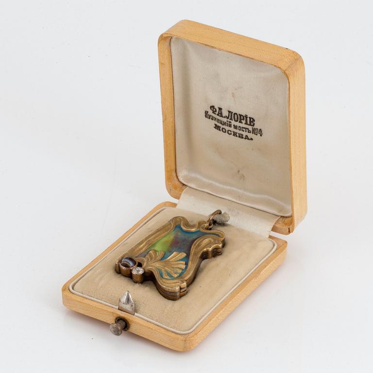 A Fedor Lorie pendant/frame, enamelled 14K gold and silver set with an old-cut diamond and banded agate.