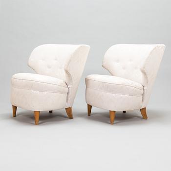 A pair of 1950's armchairs.