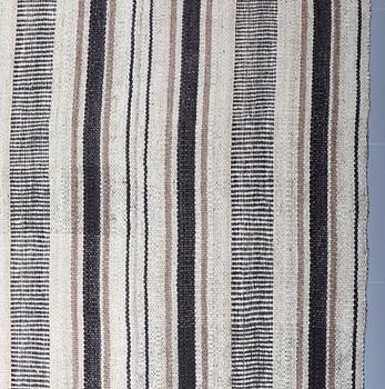 A FLATWEAVE RUG, 339 x 247 cm.