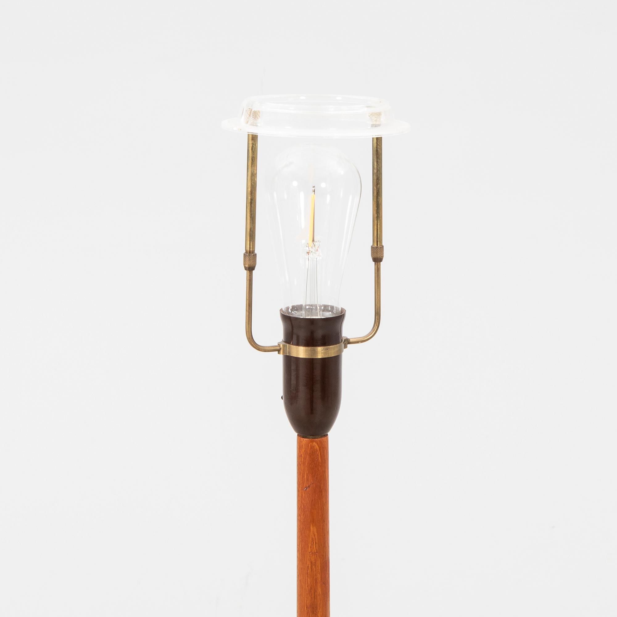 A 1940/50s teak floor lamp.