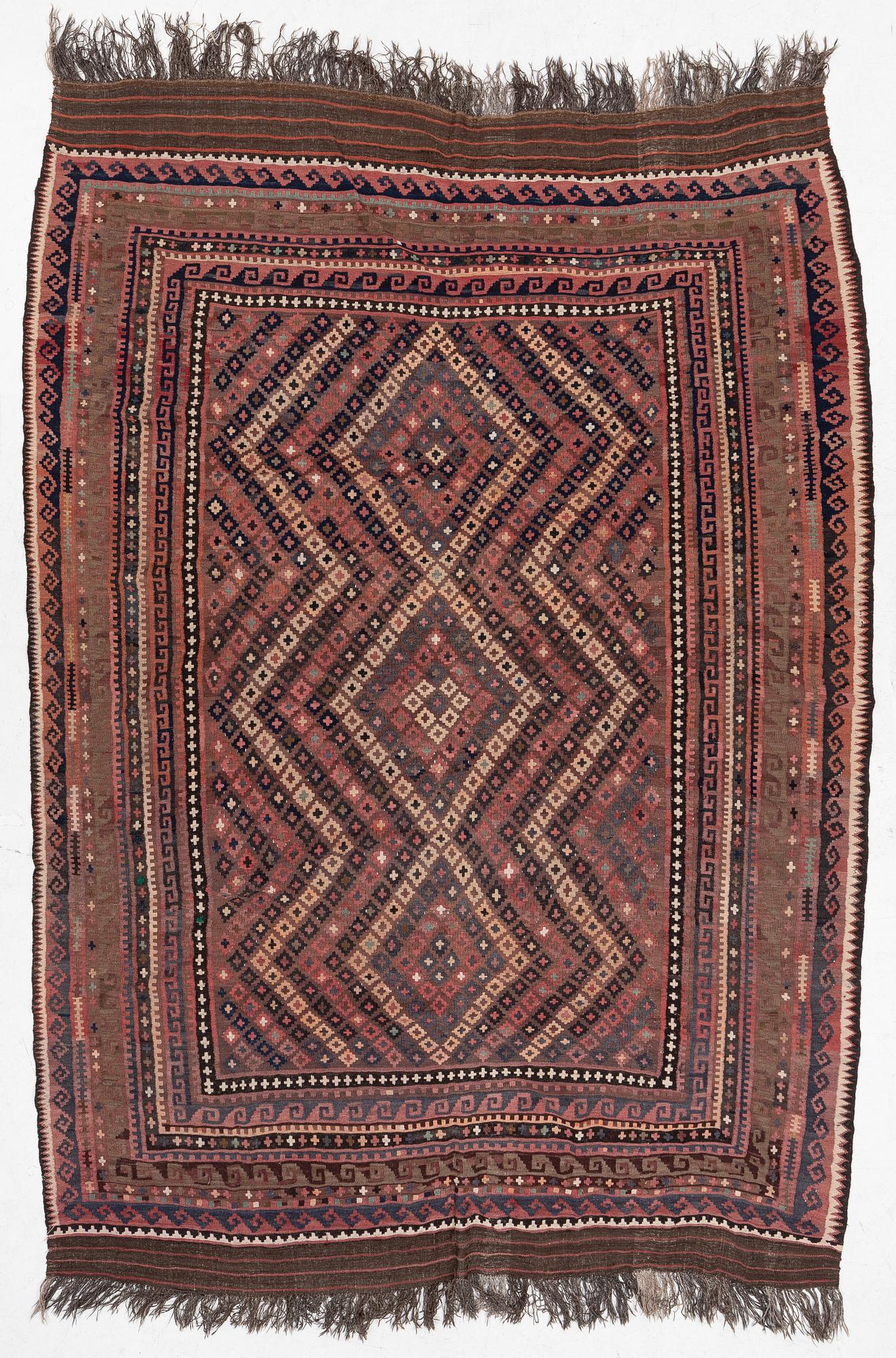 A semi-antique kilim carpet, a. 385 x 251 cm.