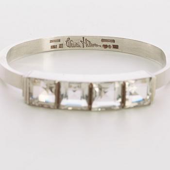 A Wiwen Nilsson sterling bangle with four facet cut rock crystals, Lund 1946.