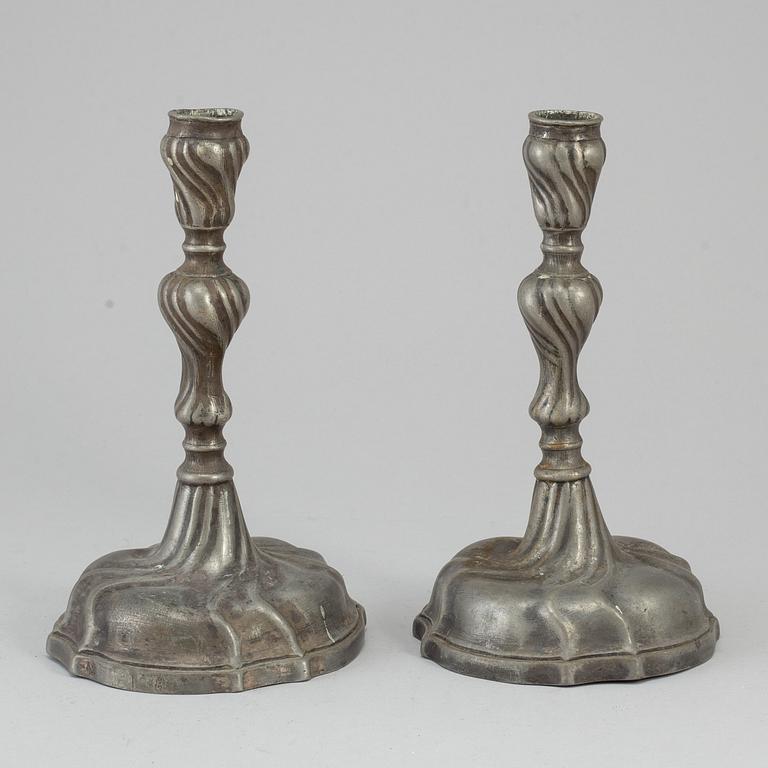 A pair of 18th century pewter candlesticks.