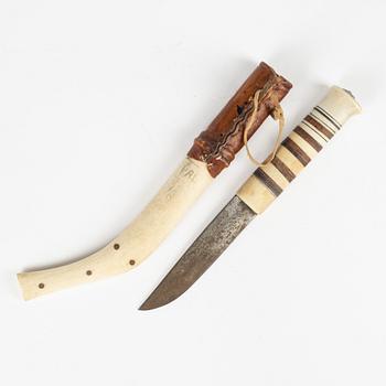 A reindeer horn knife, signed AL.