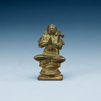 1265. A bronze figure of a seated deity, South-East Asia, presumably 15/16th Century.