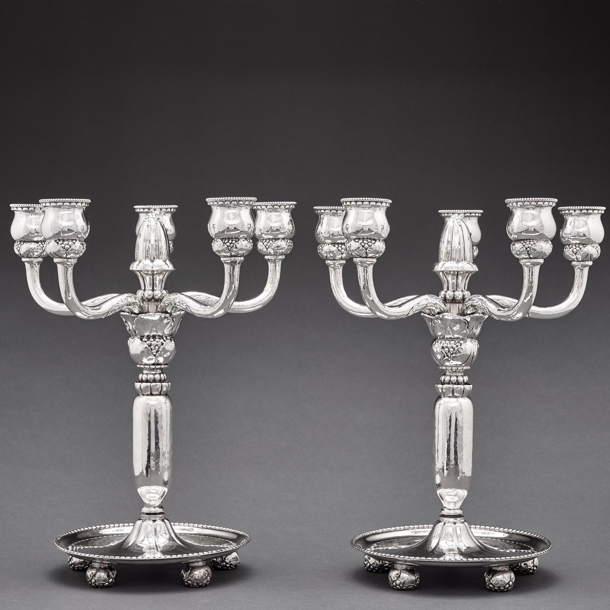 Georg Jensen, a pair of 830/1000 silver five light candelabra, Copenhagen 1920, design nr 200.
