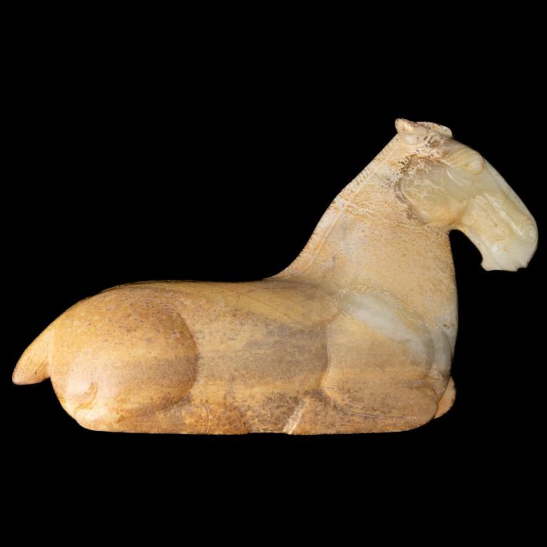 A carved nephrite figure of a reclining horse, 20th Century.